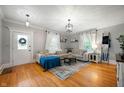 Bright living room with hardwood floors, a comfortable sectional sofa, and lots of natural light at 2708 N 400 E, Greenfield, IN 46140