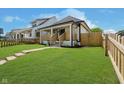 Charming home with an inviting front porch, complemented by a lush green lawn and tasteful landscaping at 2909 E Michigan St, Indianapolis, IN 46201