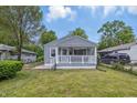 Attractive single Gathering home with a cozy front porch and a well manicured lawn at 3334 N Chester Ave, Indianapolis, IN 46218