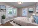 Comfortable bedroom featuring neutral tones, ample natural light, and stylish decor at 3822 Spann Ave, Indianapolis, IN 46203