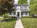 Charming two-story home with a well-manicured lawn and a symmetrical facade with classic shutters at 5342 Central Ave, Indianapolis, IN 46220