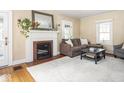 Inviting living room featuring a fireplace, neutral-toned walls, and comfortable seating arrangements at 5342 Central Ave, Indianapolis, IN 46220