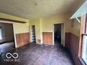 The dining room features wood floors and wall trim, offering space for meals and gatherings at 721 Haugh St, Indianapolis, IN 46222
