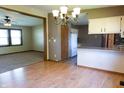 Open concept dining area with laminate wood flooring that connects to the kitchen and living room at 8370 State Road 236, North Salem, IN 46165