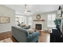 Inviting living room with a fireplace, hardwood floors, and stylish furniture at 863 Lionshead Ln, Greenwood, IN 46143