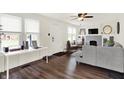 Bright living room with modern flooring, neutral walls, and a charming fireplace feature at 907 N Arlington Ave, Indianapolis, IN 46219