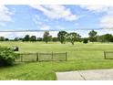 A stunning, scenic view from this single-Gathering home overlooking green space and trees at 9080 W Forest Dr, Elwood, IN 46036
