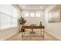 Bright office space with modern desk, decor, and a large window that brings natural light at 10922 Liberation Trce, Noblesville, IN 46060