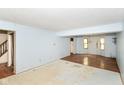 Bright living room area features staircase and entry at 1113 Delray Dr, Indianapolis, IN 46241