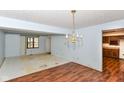 Bright living room area with hardwood floors and chandelier at 1113 Delray Dr, Indianapolis, IN 46241