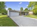 Attractive home with an attached two-car garage and long drive at 1121 Barcelona Dr, Greenwood, IN 46143