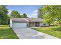 Inviting home with a long drive and attractive landscaping at 1121 Barcelona Dr, Greenwood, IN 46143