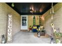 Inviting front porch with string lights, charming decor, and a cozy bench creates a welcoming entrance at 1248 Hathaway Dr, Indianapolis, IN 46229