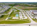 Aerial view of the community featuring Finch Creek Park, tennis courts, and a park at 12672 Amber Star Dr, Noblesville, IN 46060