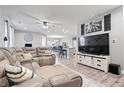 Spacious living room featuring a plush sectional sofa and an open layout at 13321 N White Cloud Ct, Camby, IN 46113