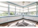 Sunroom with floor to ceiling windows and neutral paint at 13815 Plantree Dr, Carmel, IN 46033