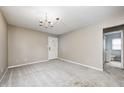Open-concept living room with view to bathroom featuring carpet and neutral walls at 148 S 3Rd Ave, Beech Grove, IN 46107