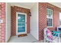 Charming front porch with brick accents, creating a welcoming entrance to the home at 2337 Hanover Rd, Brownsburg, IN 46112