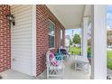 Inviting front porch featuring comfortable seating, perfect for relaxing and enjoying the neighborhood views at 2337 Hanover Rd, Brownsburg, IN 46112