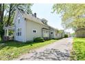 Image of the exterior and driveway, showing home and yard at 31 E Mill St, New Palestine, IN 46163
