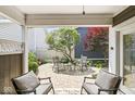 Cozy covered patio with comfortable seating and scenic backyard view at 3535 Clearwater Cir, Indianapolis, IN 46240