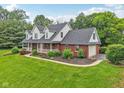 Lovely two-story home with well-manicured lawn, landscaping and attached garage at 3564 Clear Creek Blvd, Martinsville, IN 46151