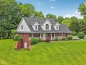 A view of the home showing a side entrance and landscaping at 3564 Clear Creek Blvd, Martinsville, IN 46151
