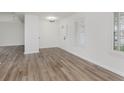 Bright entryway featuring wood-look floors, natural light, and a simple, modern aesthetic at 374 Pomona Ct, Greenfield, IN 46140
