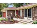 Close-up of the charming front porch with brick detail and inviting double-door entry at 434 Verwood Ct, Indianapolis, IN 46234