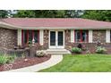 Inviting entrance with landscaped walkway, charming brickwork, and a double-door entry at 434 Verwood Ct, Indianapolis, IN 46234