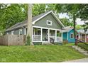 Charming home with a well-manicured lawn and welcoming front porch at 4414 Winthrop Ave, Indianapolis, IN 46205