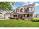 Lovely home with a spacious front porch and well-maintained landscaping at 4434 W Windsong Ct, New Palestine, IN 46163