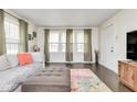 Spacious living room with ample natural light, comfortable seating, and stylish decor at 4922 Brookville Rd, Indianapolis, IN 46201