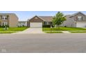 Attractive single-Gathering home with a brick facade, a two-car garage, and a beautifully manicured front lawn at 6415 Calabash Pl, Indianapolis, IN 46217