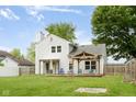 Spacious backyard featuring a deck, patio, shed, and well-maintained lawn at 7541 Southern Lakes Dr, Indianapolis, IN 46237