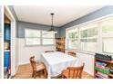Bright dining area with hardwood floors and a view to the backyard at 7725 E 52Nd St, Indianapolis, IN 46226