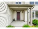 Cozy front porch with a classic door and well-manicured plants, creating a warm welcome at 8088 Lantern Ln, Pendleton, IN 46064