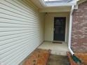 A detailed shot of the front door and surrounding vinyl siding, highlighting the well-maintained exterior at 8165 Amarillo Dr, Indianapolis, IN 46237