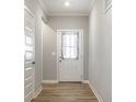 Bright entryway featuring a white door with glass panel and decorative curtains at 9718 Haughton Ln, McCordsville, IN 46055