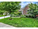 Beautiful brick home with lush green lawn and mature landscaping at 1071 Serenity Ct, Carmel, IN 46280