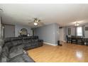 Open-concept living room with a fireplace, ceiling fan, and recessed lighting at 1135 W Wildflower Ct, Mooresville, IN 46158