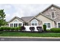 Attractive home with stone detailing, bright windows, and manicured front garden at 1150 Extraordinary Trl, Greenfield, IN 46140