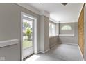 Bright entryway featuring an exterior door, large windows, with view to the outdoors at 1150 W 30Th St, Indianapolis, IN 46208