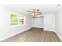 Bright bedroom with neutral walls, wood-look flooring and ceiling fan at 12029 Meadow Ln, Indianapolis, IN 46236