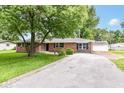 View of the property showing a driveway and detached garage at 12029 Meadow Ln, Indianapolis, IN 46236