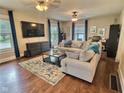 Spacious living room featuring hardwood floors, comfortable seating, and natural light at 1336 Lafayette Ave, Columbus, IN 47201