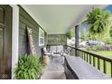 Relaxing front porch with comfortable seating, greenery, and stylish decor at 1617 S Whittier Pl, Indianapolis, IN 46203