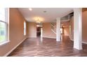 Spacious living room with stylish wood flooring and ample natural light from large windows at 16247 Countryside Blvd, Westfield, IN 46074