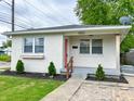 Charming single-story brick home with manicured landscaping and quaint entryway at 1653 Wade St, Indianapolis, IN 46203