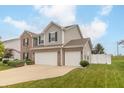 Attractive two-story home features a two-car garage and a neatly maintained lawn at 2260 Santa Fe Dr, Greenfield, IN 46140
